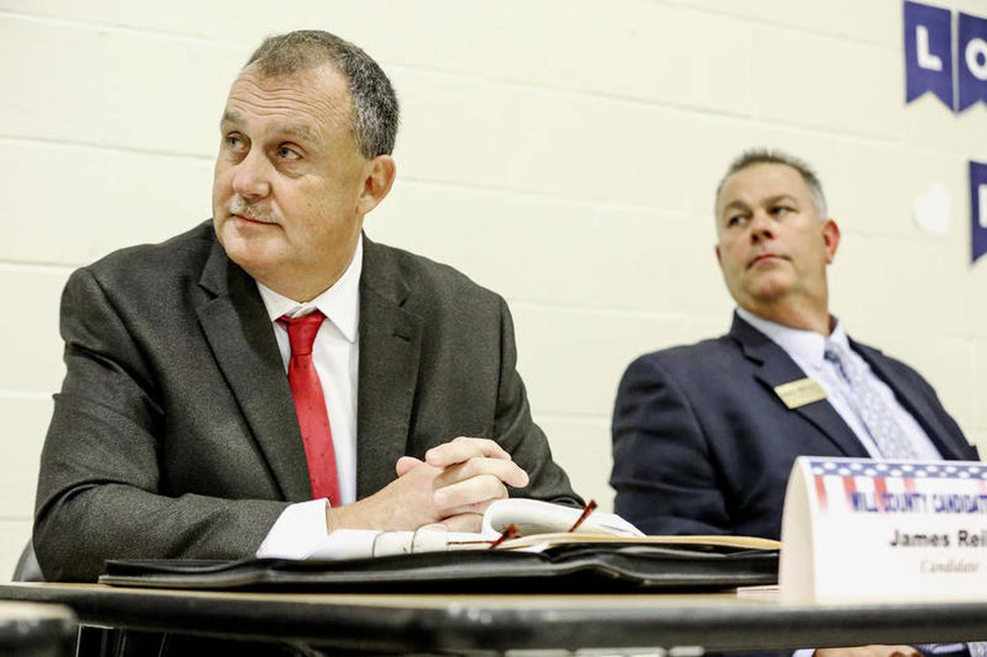 Republican Sheriff Candidate Jim Reilly (left) and Will Coutny Sheriff Mike Kelly share a table Thursday, Sept. 27, 2018, during candidate forum at Mt. Olive Missionary Baptist Church in Joliet, Ill.