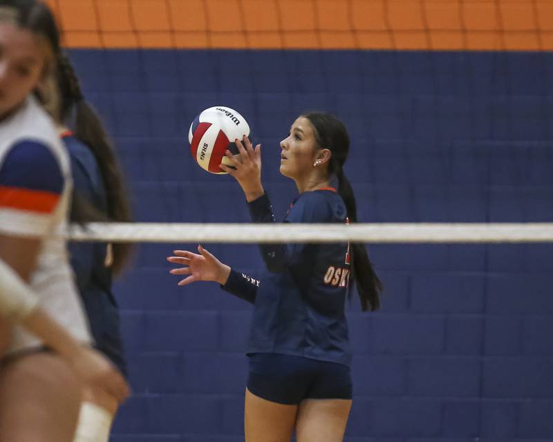 Oswego's Hannah Herrick (7) takes the ball to serve during volleyball match between Romeoville at Oswego. Oct 16, 2025.