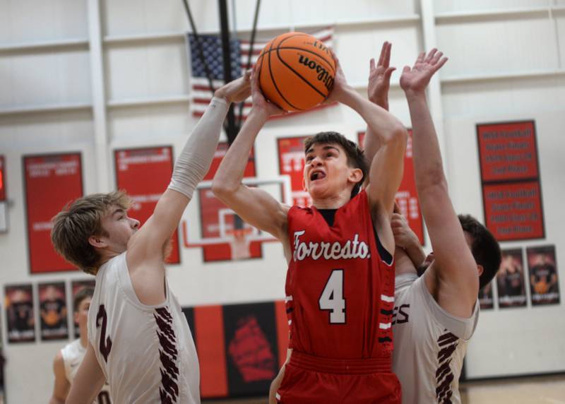 Forreston's Brady Gill (4) battles Annawan defenders during the championship of the 1A Amboy Regional on Friday, Feb. 28, 2025 at Amboy High School.