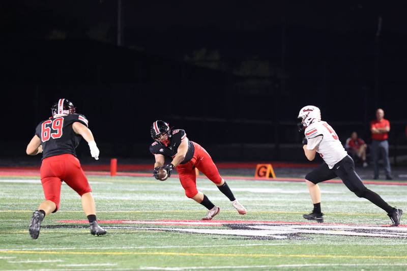 Lincoln-Way Central's Aiden Hennings secures an interception during the Knight's 28-20 victory over Bradley-Bourbonnais on Friday, Oct. 3, 2025.