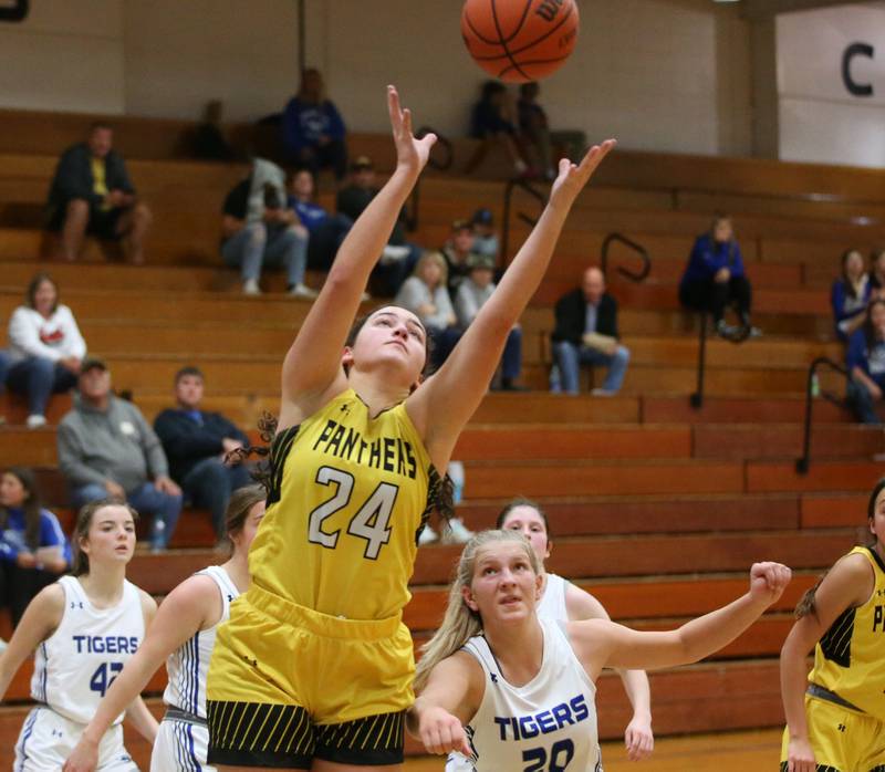 Putnam County's Maggie Richetta grabs a rebound over Princeton's Reese Reviglio during the Princeton High School Lady Tigers Holiday Tournament on Thursday, Nov. 16, 2023 at Prouty Gym.