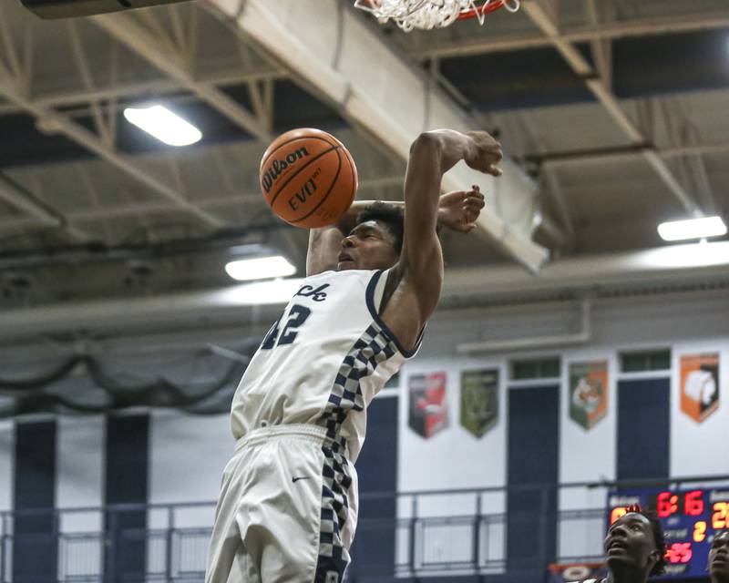 Oswego East's Dshaun Bolden (42) dunks during their basketball game between Bolingbrook at Oswego East Friday, Jan 30, 2026 in Oswego.
