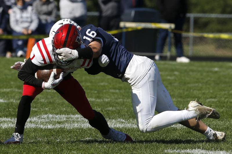 Huntley's Bryce Walker is tackled by Cary-Grove's Connor Mattranduring a Fox Valley Conference football game on Saturday, Oct. 7, 2023, at Cary-Grove High School.