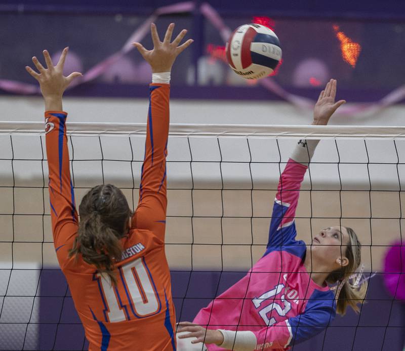 Dixon’s Isabelle Quackboerner plays the ball against Genoa-Kingston’s Bria Botterman Thursday, Oct. 17, 2024.