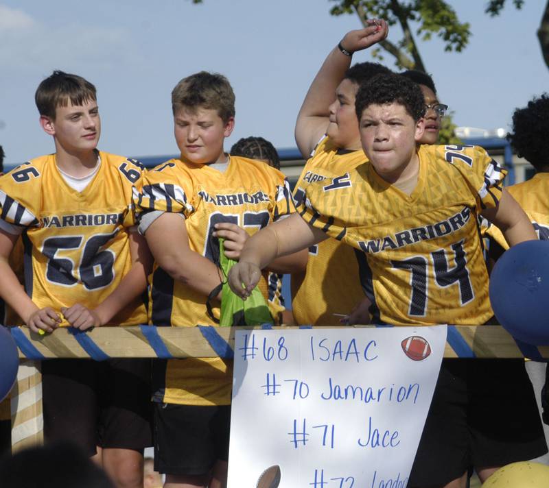 Future Golden Football palters toss candy to the crowd. The parade took place on Friday afternoon, October 3rd, 2025, prior to the HC football game.