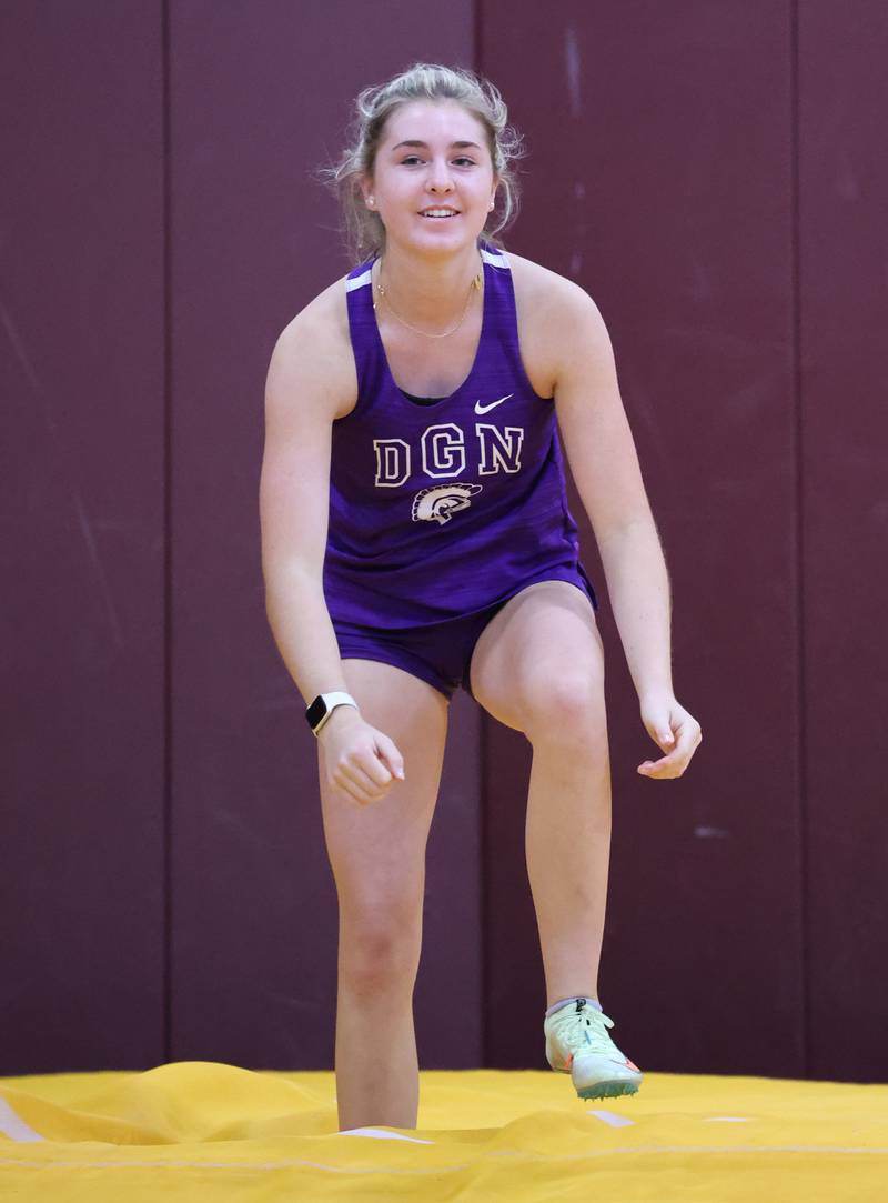 Downers Grove North's McKenna Purgatorio smiles after clearing the bar in the pole vault during the girls varsity track and field 3A Lockport sectional on Friday, May 12, 2023.