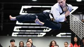 Michael Bols of Mazon medals in Team USA taekwondo competition