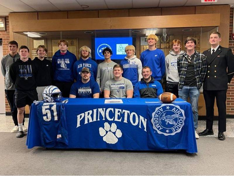 Princeton senior Bennett Williams (front center) was joined by his teammates, friends and brother for his signing day with the Air Force Academy on Friday.