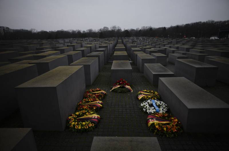 Wreaths placed at the Memorial to the Murdered Jews of Europe on the International Holocaust Remembrance Day in Berlin, Germany, Thursday, Jan. 27, 2022. The International Holocaust Remembrance Day marking the anniversary of the liberation of the Nazi dear camp Auschwitz on Jan. 27, 1945. (AP Photo/Markus Schreiber)