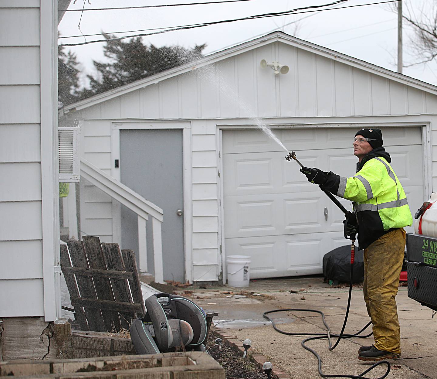 Jim Mennie owner of Precision Washing Exterior Washing, uses a power washer to rinse off the siding of a home on Porter Street on Wednesday, Jan. 18, 2023 in La Salle.