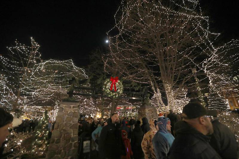 People leave the square after the Lighting of the Square ceremony on Friday, Nov. 28, 2025, in Woodstock.The annual holiday season event featured brass music, caroling, free doughnuts and cider, food trucks, festive selfie stations and shopping.