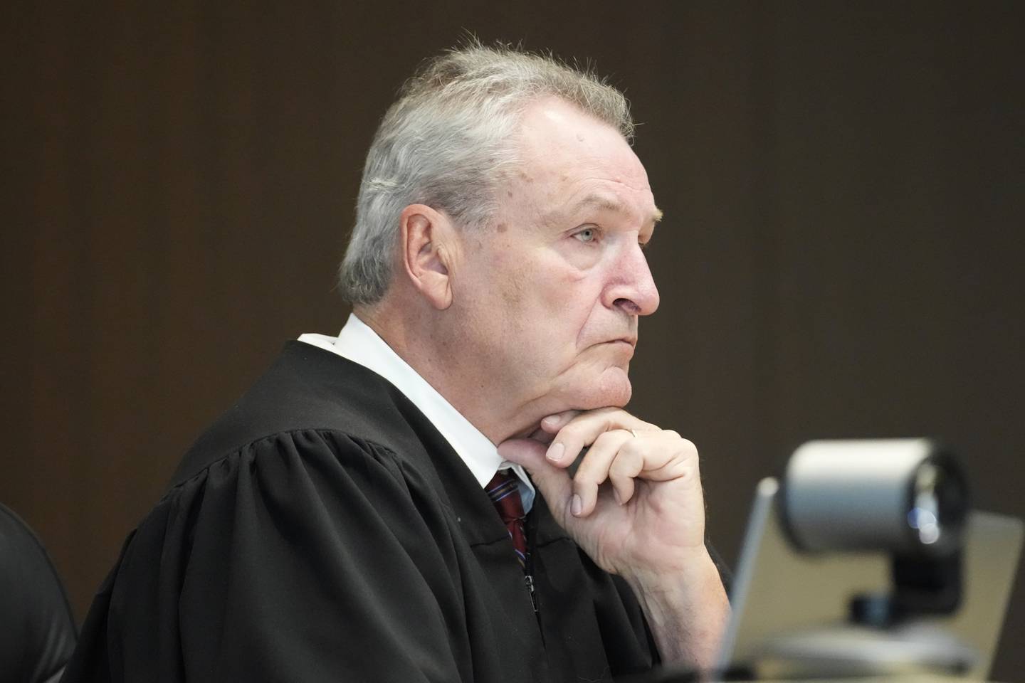 Judge George D. Strickland listens to Robert E. Crimo Jr's attorney George Gomez during an appearance at the Lake County Courthouse, Monday, Aug. 28, 2023, in Waukegan, Ill. The judge on Monday refused to dismiss the case against Crimo Jr. who helped his son obtain a gun license three years before authorities say the younger man fatally shot seven people at a 2022 Fourth of July parade in suburban Chicago. Crimo Jr.'s Nov. 6 trial will go head as previously scheduled.
