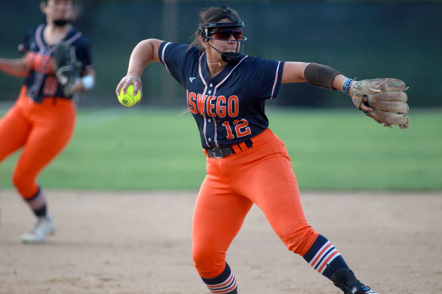 Oswego’s Aubriella Garza throws to firlst during a Class 4A Benedictine Supersectional against Marist on Monday, June 9, 2025 in Lisle.