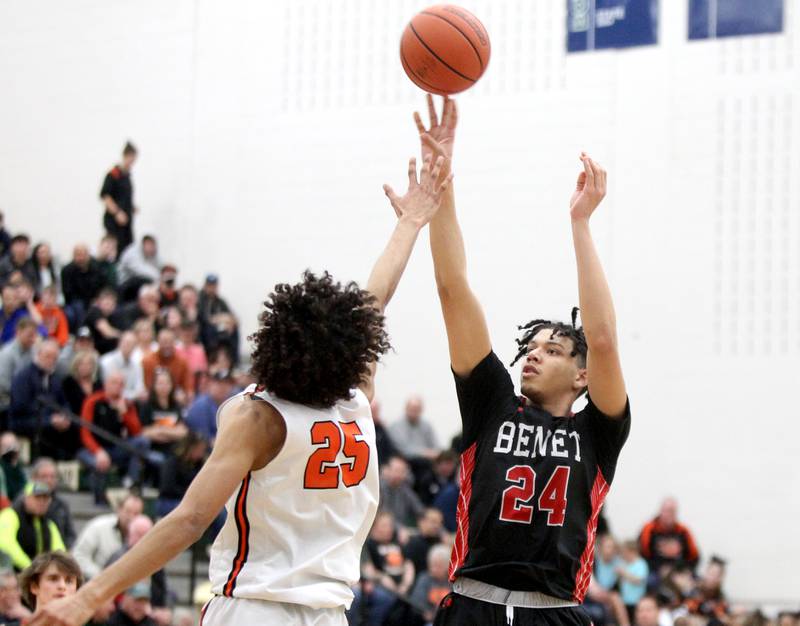 Benet’s Kyle Thomas (24) shoots the ball over Wheaton Warrenville South’s Braylen Meredith during a Class 4A Bartlett Sectional semifinal game on Wednesday, March 2, 2022.