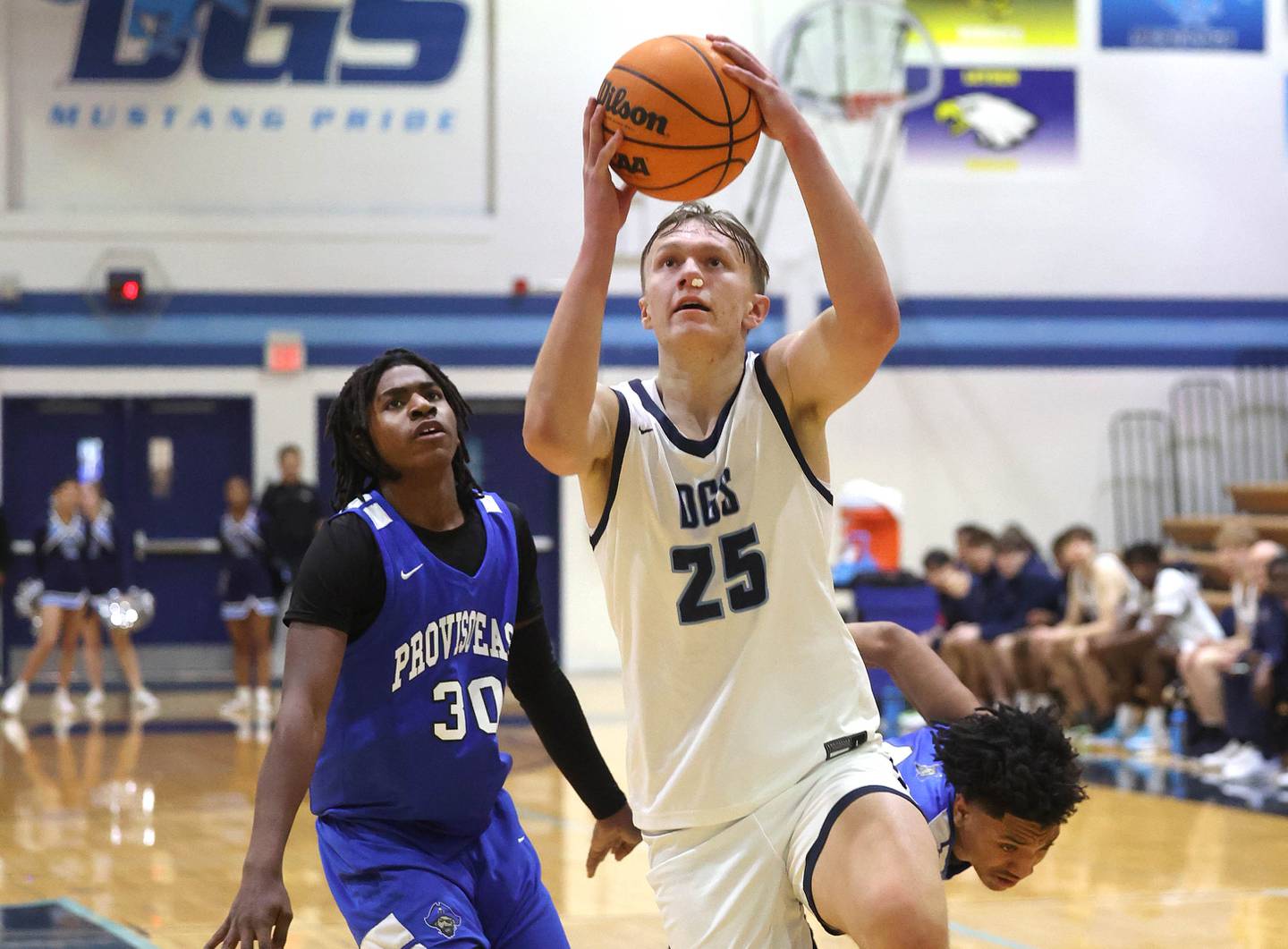 Downers Grove South's Daniel Sveiteris gets behind two Proviso East defenders for an easy basket during their game Friday, Feb. 14, 2025, at Downers Grove South High School.