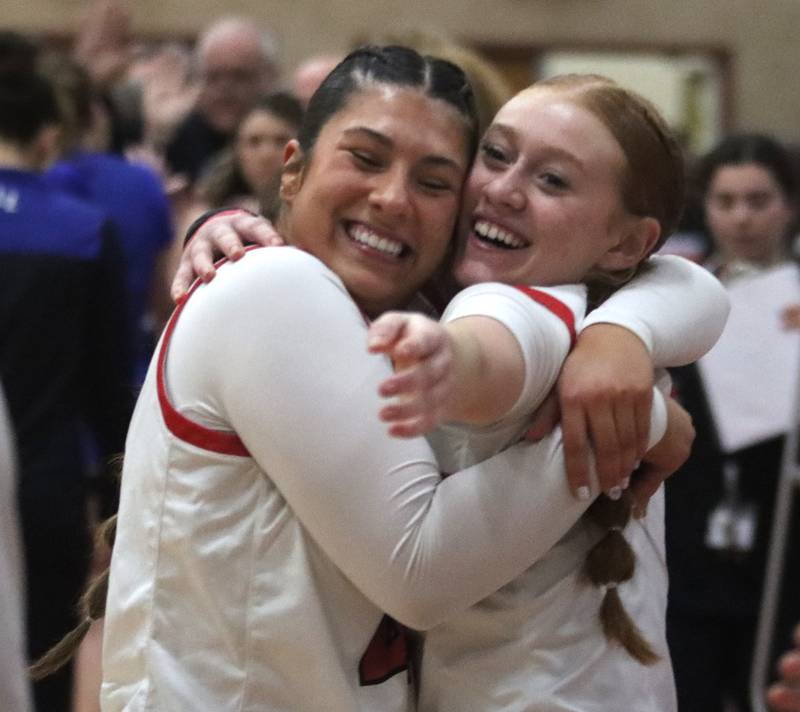 Huntley’s Madison Diaz, left, and Avery Suess celebrate a win over Lake Zurich in IHSA Class 4A Sectional girls basketball action on Tuesday, Feb. 25, 2025, at Huntley High School in Huntley.