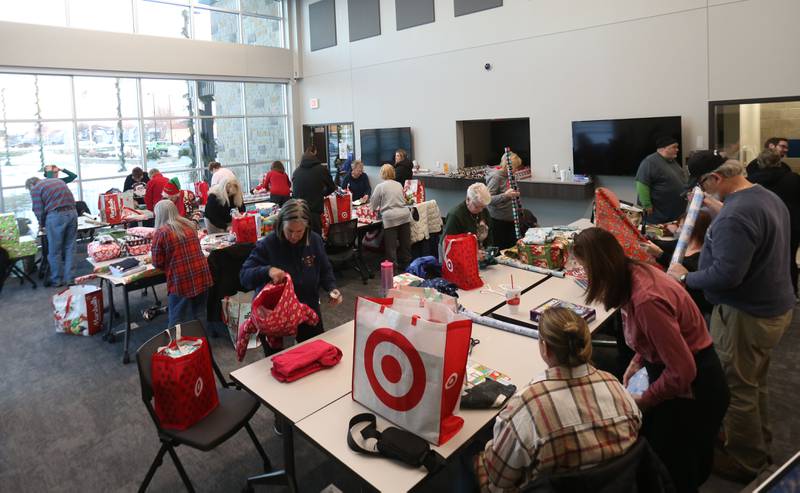 Over 50 volunteers wrapped presents for the Blue and Red Christmas for Kids on Tuesday, Dec. 16, 2025 at the City of Peru Public Safety Complex. Blue and Red will be delivering gifts to 85 children on Friday, Dec. 19. Area schools provided toys to fire and police departments with children's names and their Christmas lists. The program relays on donations including a $2,000 donation from the City of Peru in November. The Christmas program was established in 2013 by the Peru police and fire departments. It donates more than gifts to children in need; it provides personalized gifts for each child and family, including clothing and toys.