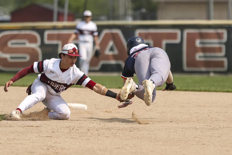 Oswego's Dylan King (20) dives for second during Class 4A Plainfield North Regional final baseball game between Oswego at Plainfield North. Saturday, May 31, 2025 in Plainfield.