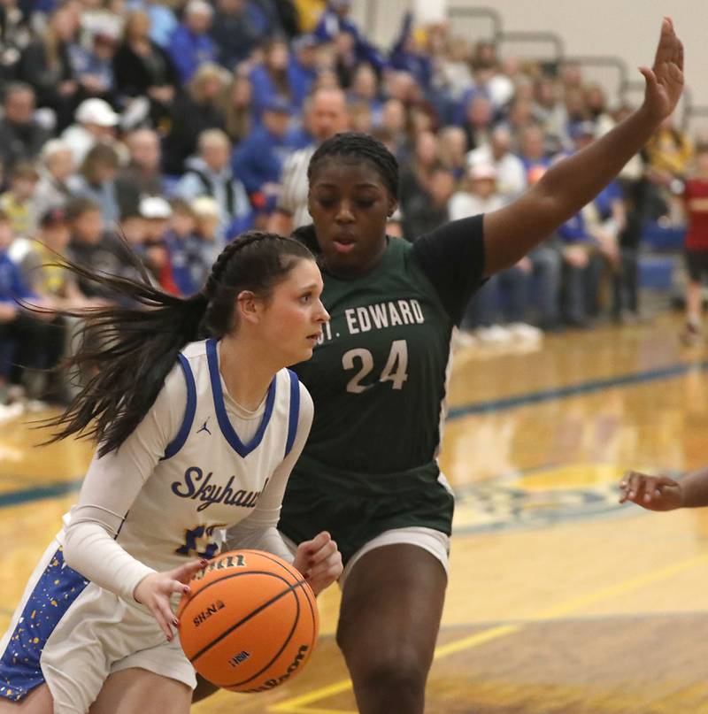 Johnsburg's Addie Graff drives th ebasline against St. Edward's Sanaii McPherson during the IHSA Class 2A Johnsburg Sectional girls basketball championship game on Thursday, February, 26, 2026, at Johnsburg High School.