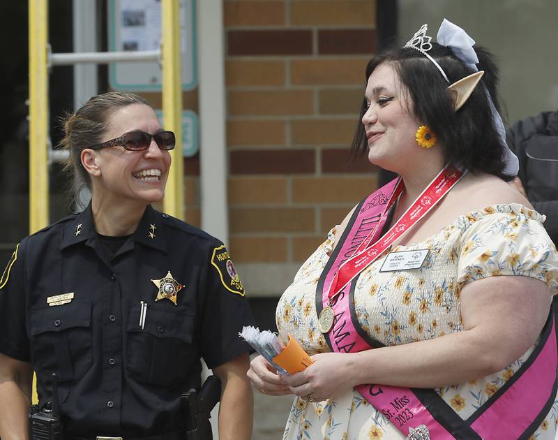 Huntley Police Department Deputy Chief Linda Hooten talks Friday, May 19. 2023, with Special Olympian Catherine Barnes at Dunkin’ during the Cop on a Rooftop fundraiser to raise awareness for Special Olympics Illinois and the Law Enforcement Torch Run to benefit Special Olympics. Huntley Police Department officers, in support of the Law Enforcement Torch Run for Special Olympics Illinois, took to the roofs and ground around both Huntley Dunkin’ locations before finishing the day with the seventh annual doughnut-eating contest that was won by Matthew Ganek of the Huntley Police Department.