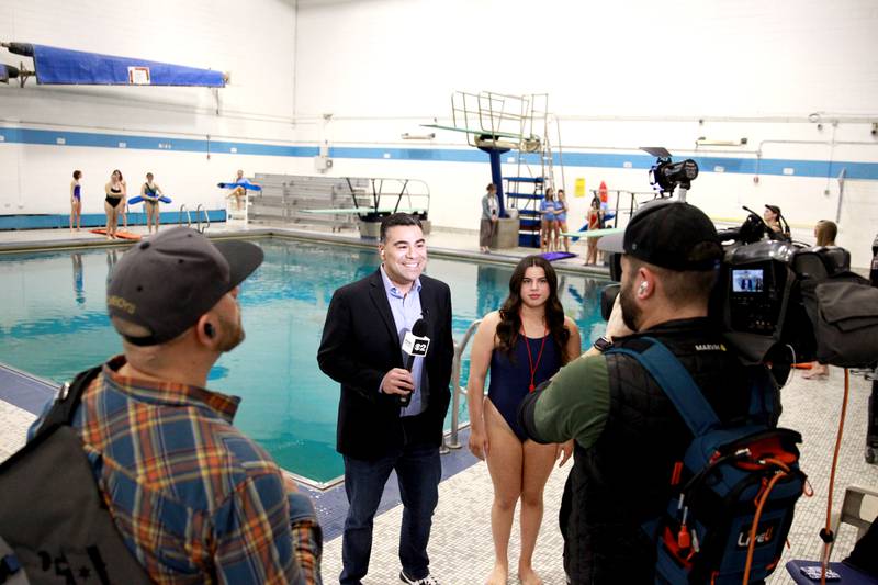 Albert Ramon, chief meteorologist for CBS2 Chicago, interviews Downers Grove South student Payton Di Prospero as part of the television station’s day-long school spotlight coverage on Friday, Feb. 23, 2024.