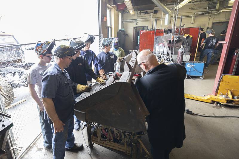 Rock Falls High School Industrial Arts instructor Matt Boostrom (left) leads his class on a project Thursday, April 20, 2023 at the school.