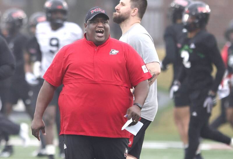 Northern Illinois University football head coach Thomas Hammock instructs his team during spring practice Wednesday, March 23, 2022, at NIU in DeKalb.