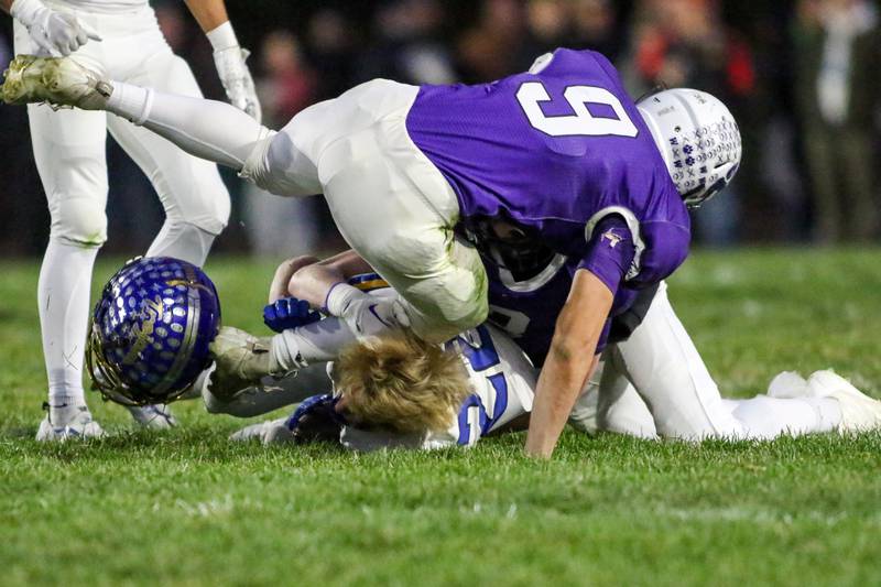 Moroa-Forsyth's Kaiden Maurer (22) loses his helmet while being tackled during Class 2A semi-final playoff football game between Moroa-Forsyth at Wimington.  Nov 18, 2023.