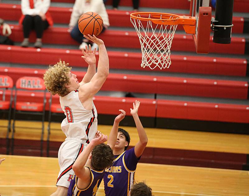 Hall's Mac Resetich scores a bucket over Mendota's Dom Stamberger and Issac Guzmann on Tuesday, Jan. 3, 2023 at Hall High School.