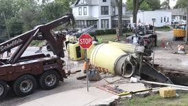 Photos: Cement truck falls into sinkhole in Peru