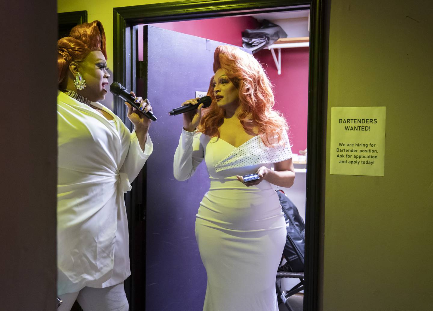 Joel Filmore, right, also know as Moana Lotte, along with co-host Dymond Calloway, of Chicago, do a microphone check backstage before performing during "The Dollhouse: A Drag ReVue" on Saturday, Dec. 3, 2022, at the Martini Room in Elgin.