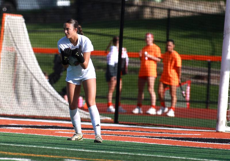 Batavia goal keeper Gianna Reid makes a save during a Tri-Cities Soccer Night game against Geneva on Tuesday, April 29, 2025 at St. Charles East.