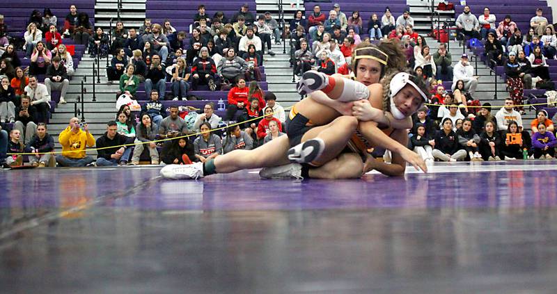 Jacobs’ Julia Felton, back, battles McHenry’s Alexa Colin-Garcia at 110 pounds in varsity girls IHSA Regional Championship wrestling action on Saturday, February 7, 2026, at Hampshire High School in Hampshire.
