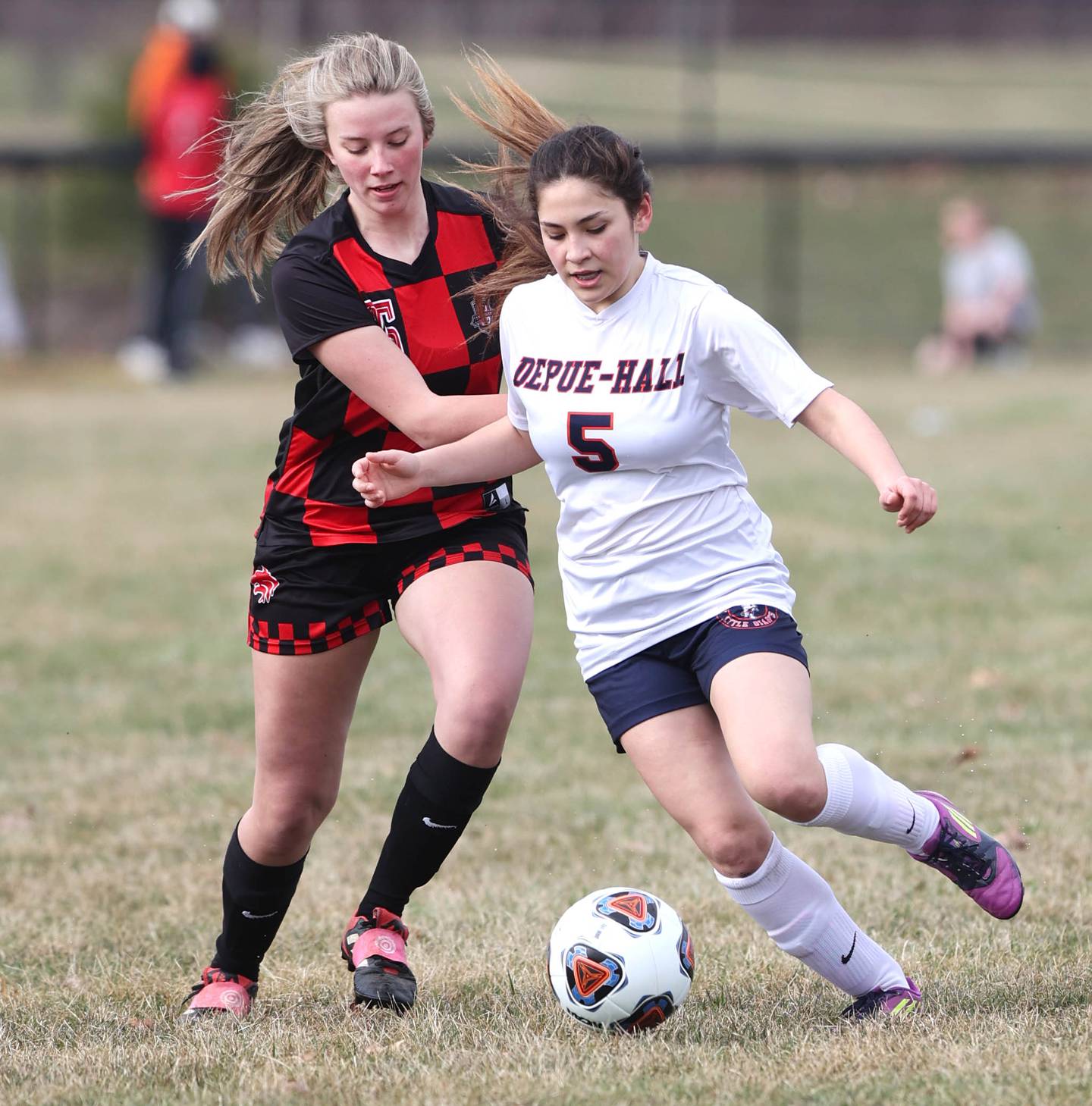 DePue's Veronica Fitzgerald and Indian Creek's Delia Diehl fight for possession during their game Tuesday, April 5, 2022, at Indian Creek Middle School in Waterman.