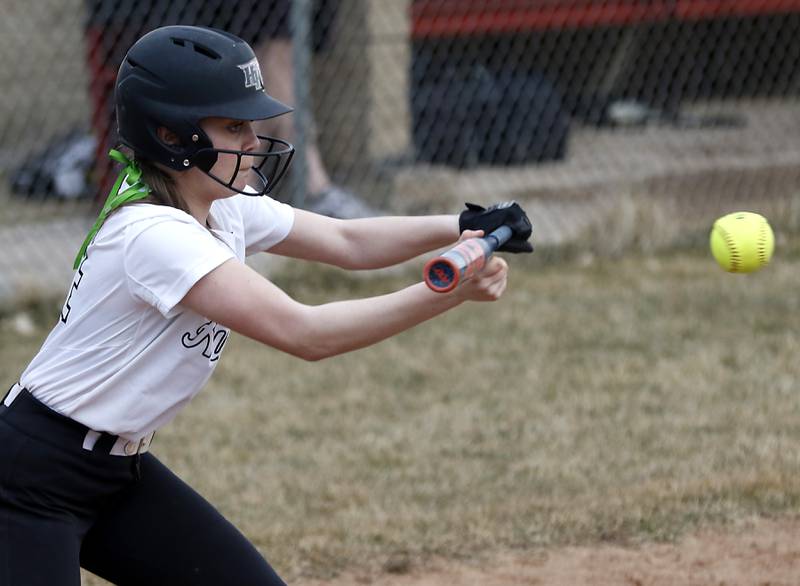 Huntley’s Madison Rozanski bunts the ball to move the runner during a non-conference softball game Thursday March 17, 2022, between Huntley and Fremd at Huntley High School.