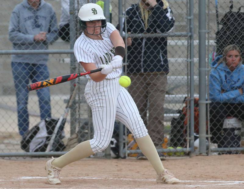 St. Bede's Bella Pinter makes contact with the ball against Marquette on Thursday, April 18, 2024 in Ottawa.