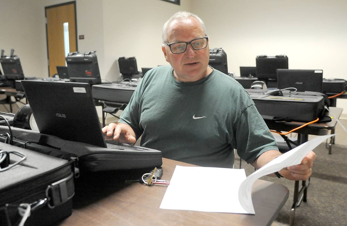 Election judge John Ulaszek, of Cary, practices using a voting machine Monday, May 16, 2022, at McHenry County Clerk's Office, 667 Ware Road, in Woodstock, as election judges are trained. Early voting starts for the primary election on Thursday, May 19, at the County Clerk's Office.