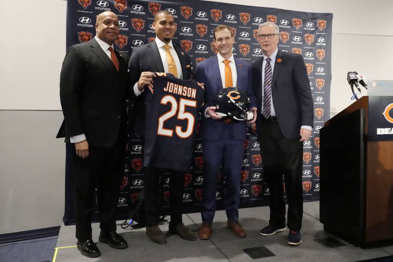Chicago Bears President and CEO Kevin Warren, left, general manager Ryan Poles, second from left, new head coach Ben Johnson and team owner George McCaskey, right, pose for photo during an NFL football news conference at Halas Hall in Lake Forest, Ill., Wednesday, Jan. 22, 2025. (AP Photo/Nam Y. Huh)