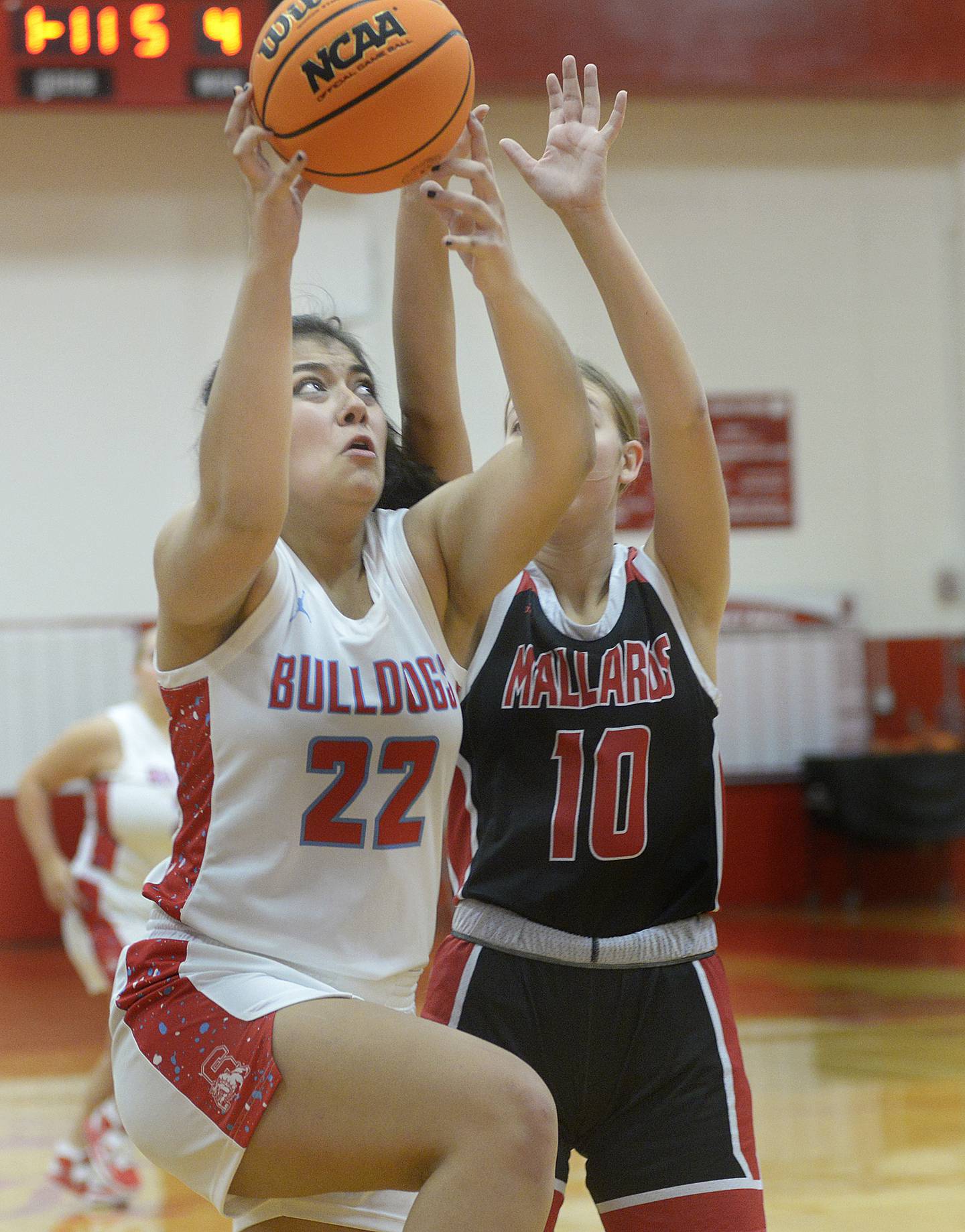 Streator’s Alexis Thomas gets up and over the block attempt by Henry-Senachwine’s Rachel Eckert in the first period Tuesday at Streator.
