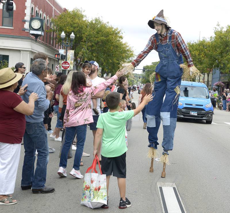 Head and shoulders above the rest in Ottawa’s Fall Fest Parade was a scarecrow on stilts Sunday, Sept. 29, 2024, greeting those along the downtown parade route.
