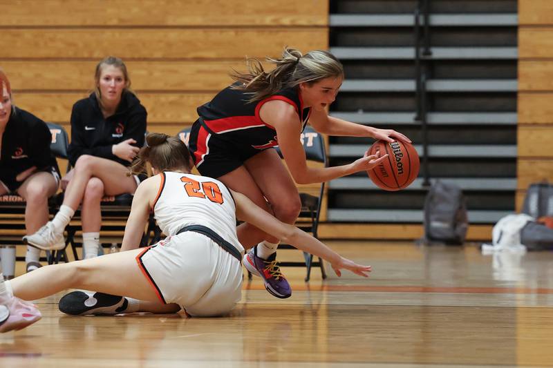 Lincoln-Way Central’s Gian Amadio gets tripped up making a play against Lincoln-Way West on Tuesday, February 7th..