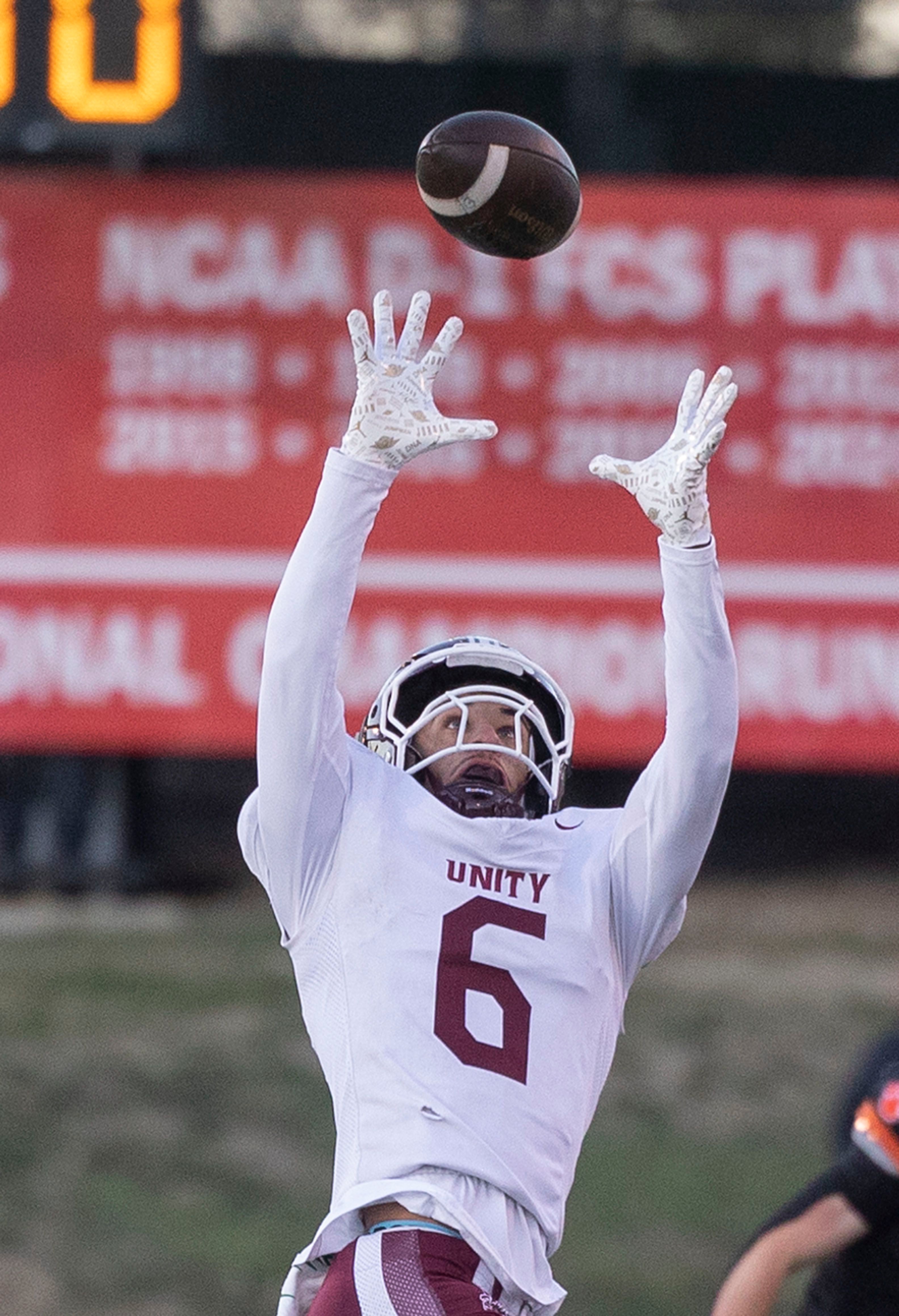 Tolono-Unity's Tre Hoggard hauls in a pass against Byron Friday, Nov. 28, 2025, in the Class 3A football finals at Hancock Stadium at ISU.