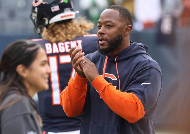 New Chicago Bears offensive coordinator Thomas Brown applauds as players go through their warmups before the Bears play the Packers Sunday, Nov. 17, 2024, at Soldier Field in Chicago.