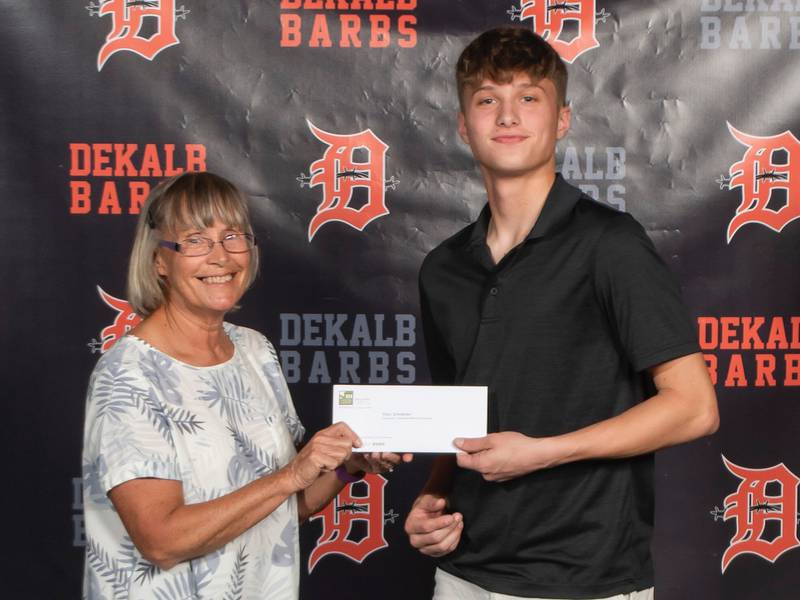 Cindy Lofthouse presenting the 2022 Christopher Anderson Memorial Scholarship to Ethan Scheidecker