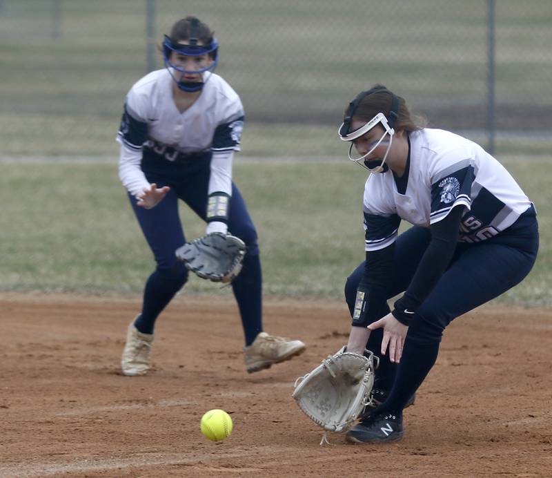 Cary-Grove’s Mia Olson, right, fields the ball as is backed up by Zoe Dudek during a Fox Valley Conference softball game Monday, April 4, 2022, between Cary-Grove and Dundee-Crown at Cary-Grove High School.