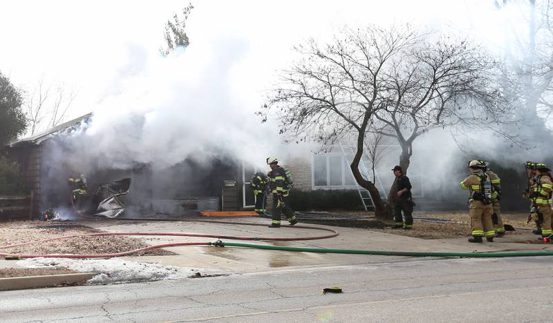 Firefighters work the scene of a garage fire in the 1900 block of Shooting Park Road on Monday, Feb. 9, 2026 in Peru. La Salle, Peru, Utica, Oglesby and Spring Valley fire departments were dispatched around 12:15p.m. to the fire.