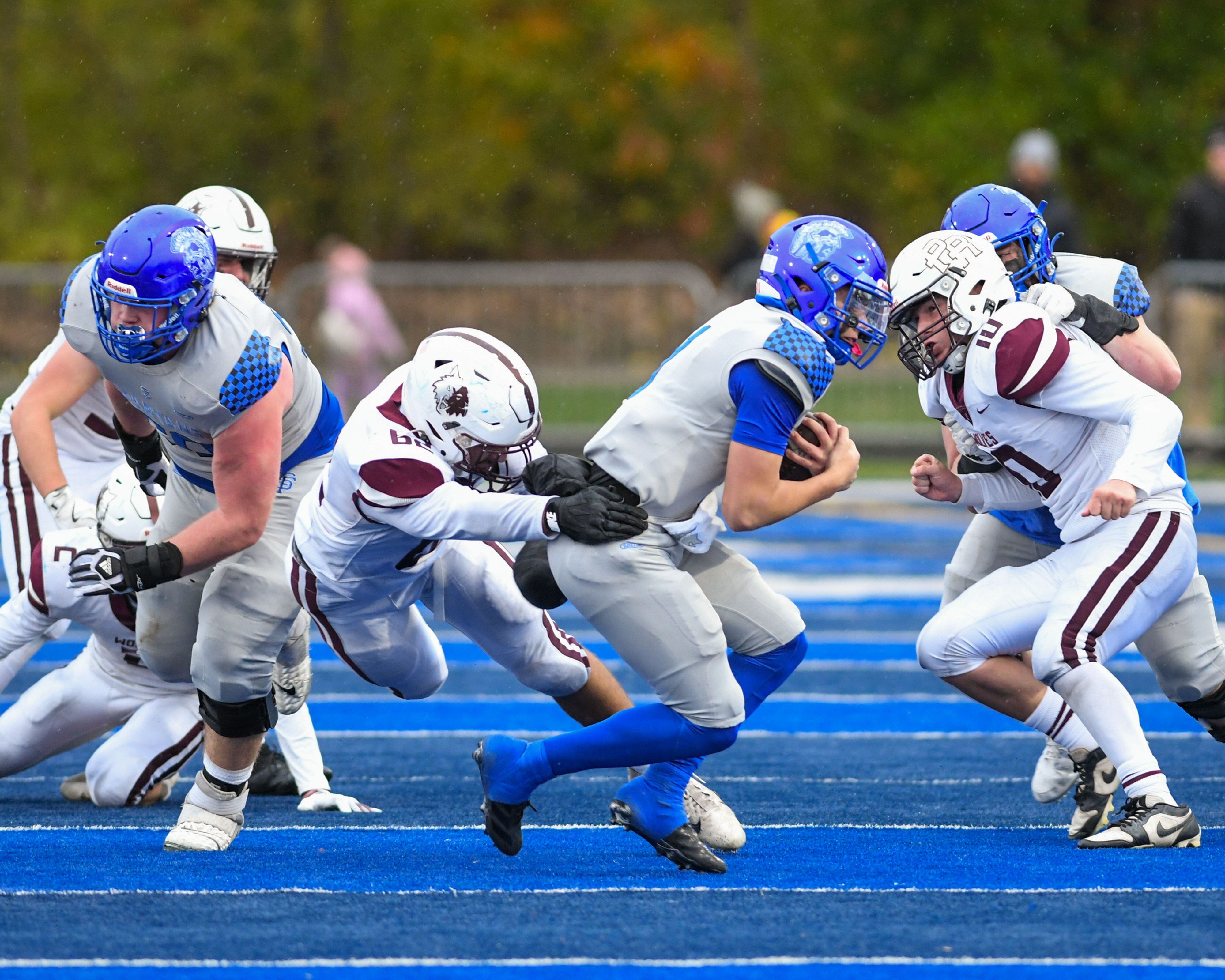 Prairie Ridge's Angelo Kay (62) brings down St. Francis's Brock Phillip (1) during the second round of the 5A playoff game on Saturday Nov. 8, 2025, held at St. Francis's High School.
