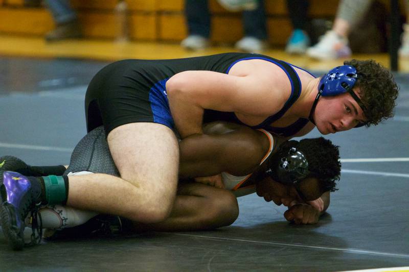 Geneva's John Schmidt wrestles St. Charles East's Anthony Chiaro in the 195-pound championship round at the DuKane Conference at Glenbard North  on Jan. 29, 2022 in Carol Stream.