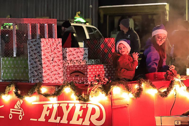 Emma and son Colton Reisenbegler rode on the Reisy Door Radio Flyer float for the annual Erie Christmas Parade Saturday, Dec. 7, 2025.