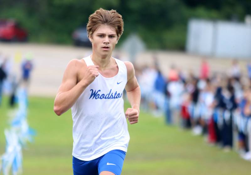Woodstock’s Ellery Shutt finishes the boys varsity race during the McHenry County Cross Country Meet at Emricson park in Woodstock on Saturday, August 30, 2025.